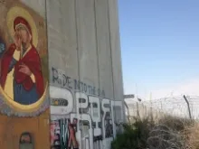 Icon of Mary written on wall dividing Israel and Palestine May 24, 2014 