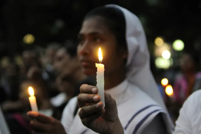 India prayer candle nun Creditarindambanerjee  Shutterstock