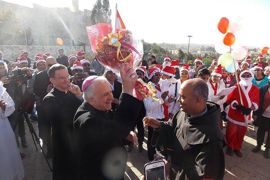 Bishop William Shomali, an auxiliary of the Patriarchate of Jerusalem, blesses the Indian Chaplaincy's Christmas peace pilgrimage to Bethlehem, Dec. 13, 2014. ?w=200&h=150