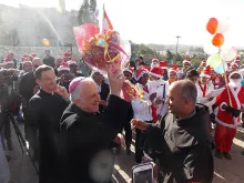 Bishop William Shomali, an auxiliary of the Patriarchate of Jerusalem, blesses the Indian Chaplaincy's Christmas peace pilgrimage to Bethlehem, Dec. 13, 2014. 
