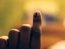 Indian citizens voting in the general elections receive a mark on their finger after casting a ballot. 