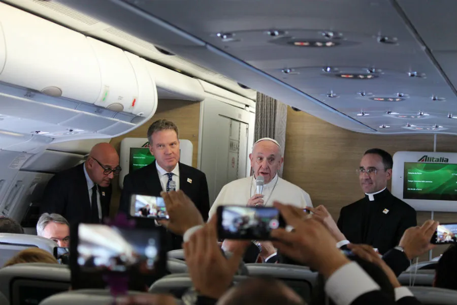Pope Francis speaks to journalists aboard the papal flight to Bogota, Colombia on September 6, 2017.?w=200&h=150
