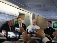 Pope Francis speaks to journalists aboard the papal flight to Bogota, Colombia on September 6, 2017.