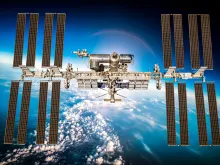 International Space Station over the planet earth. Elements of this image furnished by NASA. 
