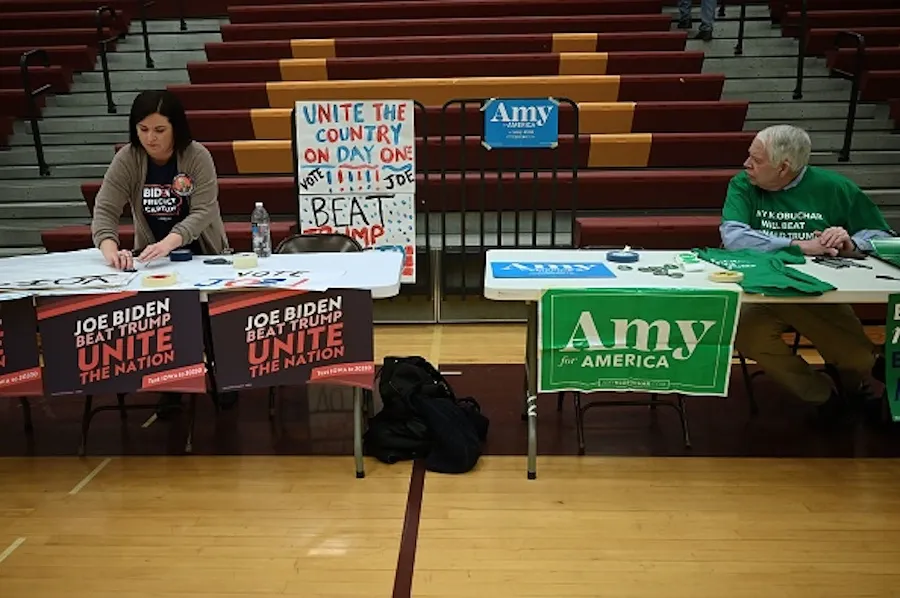 Precinct captains prepare for the opening of the Iowa Caucus at Lincoln High School in Des Moines, Iowa, Feb. 3, 2020. ?w=200&h=150