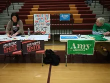 Precinct captains prepare for the opening of the Iowa Caucus at Lincoln High School in Des Moines, Iowa, Feb. 3, 2020. 