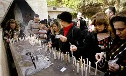 Iraqi Christians light candles affter attencing Christmas Mass in Baghdad on Dec. 25, 2008. ?w=200&h=150