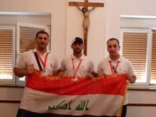Iraqi Christians before the cross.