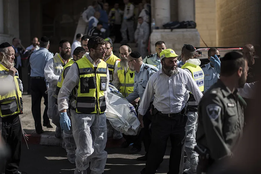 Israeli emergency personnel remove body of an Israeli man killed in a synagogue in Jerusalem on Nov. 18, 2014. ?w=200&h=150