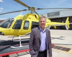 Jeff Puckett stands in front of his Bell 407 helicopter he's dubbed PrayerOne. ?w=200&h=150