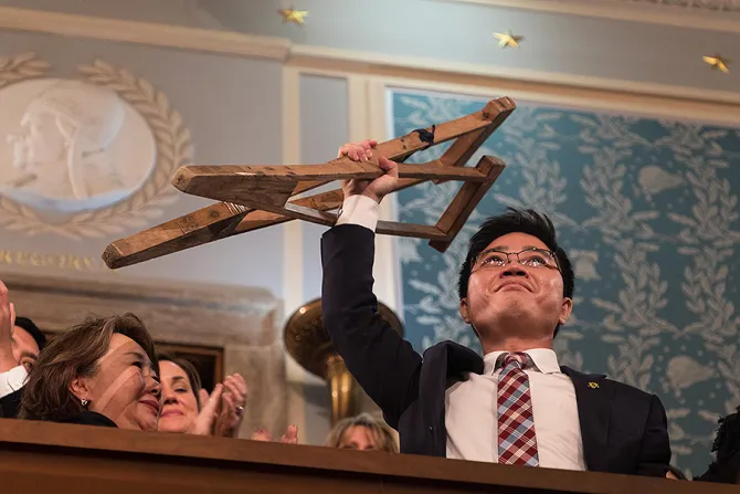 Ji Seong ho holds his crutches at the 2018 State of the Union address Public Domain CNA