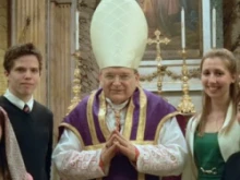 Jonathan Wasserman and Kristina Landry on either side of Cardinal Raymond L. Burke.