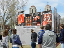 Students view the display erected by Justice for All on Denver's Auraria campus