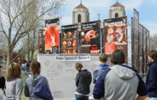 Students view the display erected by Justice for All on Denver's Auraria campus 