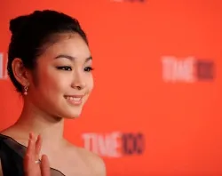 Kim Yuna waves to crowds while wearing her rosary ring in New York City, May 4, 2010. ?w=200&h=150