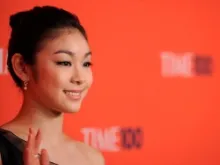 Kim Yuna waves to crowds while wearing her rosary ring in New York City, May 4, 2010. 