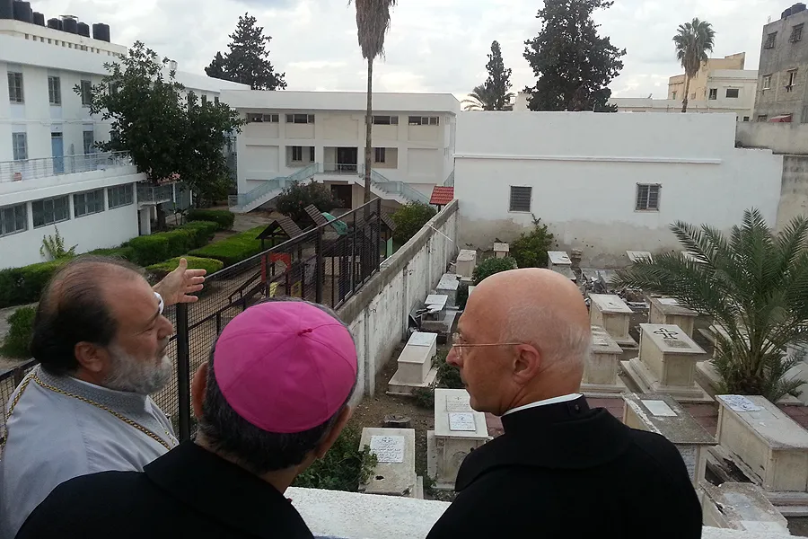 (L-R) Orthodox Archbishop Alexios, Latin Patriarch Fouad Twal, and Cardinal Angelo Bagnasco view the Orthodox cemetery Nov. 4, 2014, that was hit by Israeli rockets. ?w=200&h=150