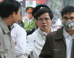 Le Quoc Quan is escorted by police. ?w=200&h=150