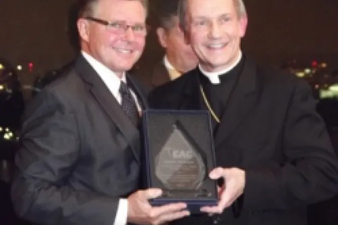 Legendary NHL referee Kerry Fraser receives an award from Bishop Thomas J Paprocki of Springfield Illinois CNA US Catholic News 10 10 12