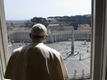 Pope Francis looks out at an empty St. Peter's Square. 