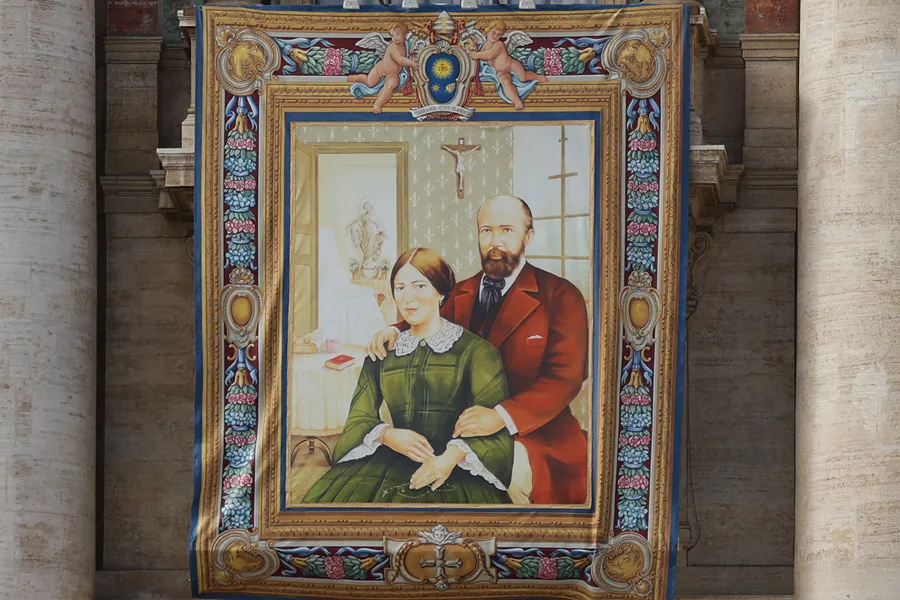 A tapestry of Blessed Louis and Zelie Martin, parents of St. Therese of Lisieux, hanging in St. Peters Square Oct. 16, 2015, in preparation for their canonization on Sunday.?w=200&h=150