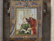 A tapestry of Blessed Louis and Zelie Martin, parents of St. Therese of Lisieux, hanging in St. Peters Square Oct. 16, 2015, in preparation for their canonization on Sunday.