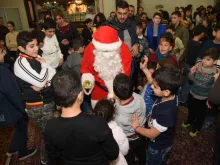 Lebanese Christian children meet St. Nicholas during a 2018 gift drive by St. Rafka Mission of Hope and Mercy. 