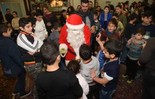 Lebanese Christian children meet St. Nicholas during a 2018 gift drive by St. Rafka Mission of Hope and Mercy.   SRMHM.
