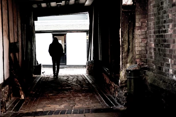 Man in shadows Credit Thomas Holt CNA