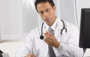 Man writing prescription.   Jupiterimages/Creatas/Getty Images