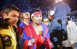Manny Pacquiao walks into the ring before his bout with Brandon Rios in their WBO International Welterweight title fight on Nov 24, 2013 in Macau. ?w=200&h=150