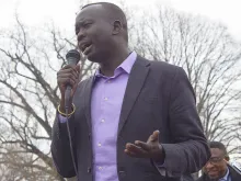 Manyang Reath Kher speaks March 28 at a refugee rally outside the White House. 