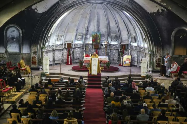 The Church of Mar Behnam and Mart Sarah in Qaraqosh, Iraq celebrates Christmas Mass Dec. 25, 2018 before the church's renovation. ?w=200&h=150