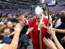 Archbishop Bernard Hebda greets students after the Mass of the Holy Spirit Oct. 10 at U.S. Bank Stadium in Minneapolis. 