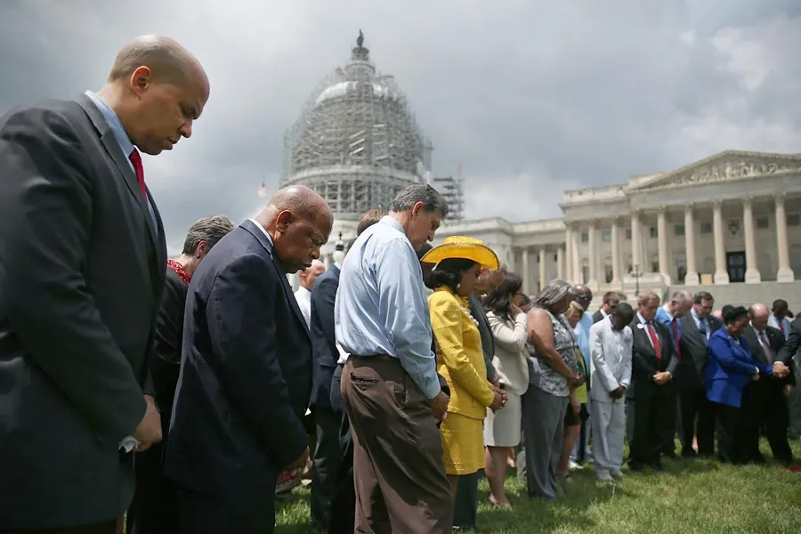Members of Congress hold a prayer circle for Charleston shooting victims outside the White House, June 18, 2015. ?w=200&h=150