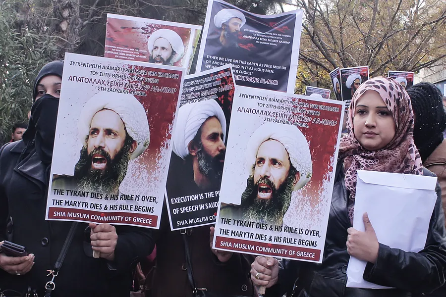 Members of Shia Muslim community of Greece hold posters of Sheikh Nimr al-Nimr during a protest rally outside of Saudi Arabia's embassy on January 6. 2016. (Photo by Milos Bicanski/Getty Images)  ?w=200&h=150