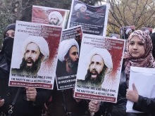 Members of Shia Muslim community of Greece hold posters of Sheikh Nimr al-Nimr during a protest rally outside of Saudi Arabia's embassy on January 6. 2016. (Photo by Milos Bicanski/Getty Images)  