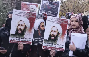 Members of Shia Muslim community of Greece hold posters of Sheikh Nimr al-Nimr during a protest rally outside of Saudi Arabia's embassy on January 6. 2016. (Photo by Milos Bicanski/Getty Images)   