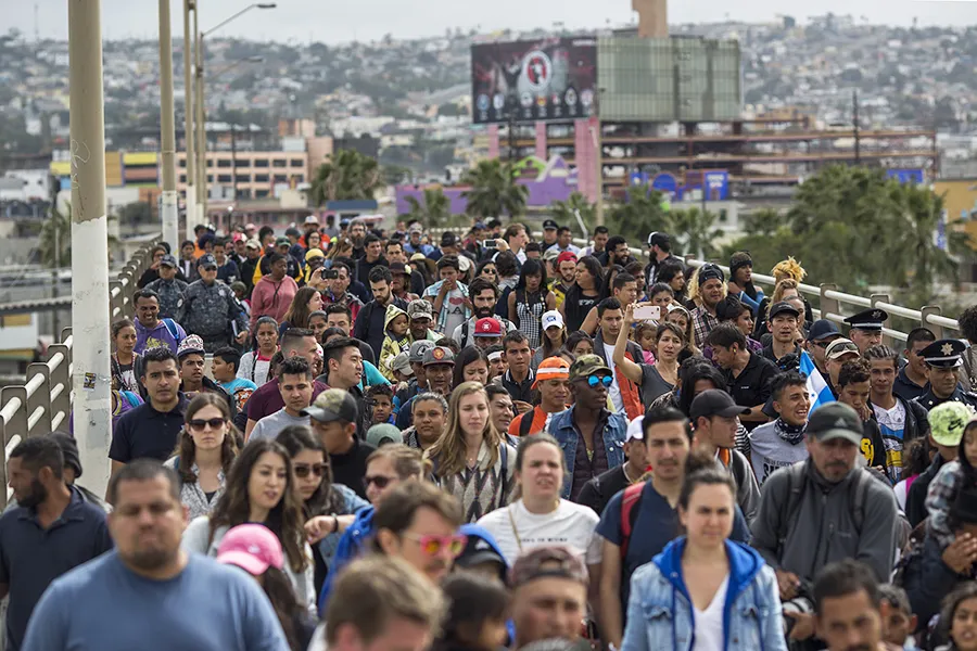 Members of a caravan of Central Americans walk from Mexico to the U.S. side of the border with supporters to ask for asylum on April 29, 2018 in Tijuana, Mexico.  ?w=200&h=150