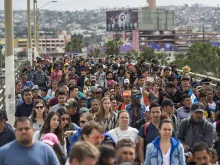 Members of a caravan of Central Americans walk from Mexico to the U.S. side of the border with supporters to ask for asylum on April 29, 2018 in Tijuana, Mexico.  