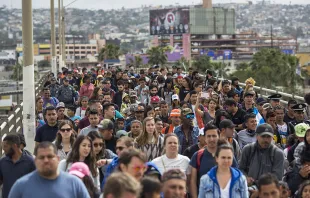 Members of a caravan of Central Americans walk from Mexico to the U.S. side of the border with supporters to ask for asylum on April 29, 2018 in Tijuana, Mexico.    David McNew/Getty Images