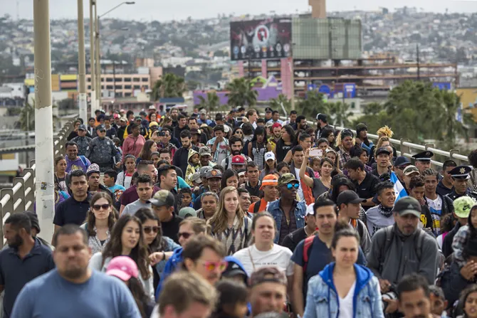 Members of a caravan of Central Americans walk from Mexico to the US side of the border on April 29 2018 in Tijuana Credit David McNew Getty Images CNA