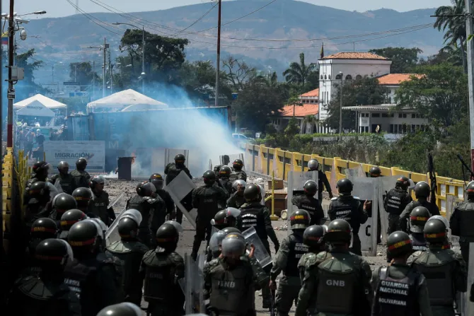 Members of the Venezuelan National Guard clash with opposition protesters on the Simon Bolivar international bridge between Venezuela and Colombia Feb 24 2019 Credit Federico Parra  AFP Get
