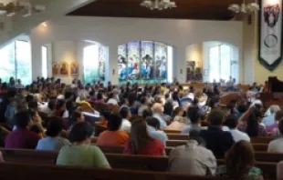 Memorial Mass on July 21 at Queen of Peace Catholic Church in Aurora, Colo. for the shooting victims. 
