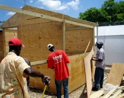Men build transitional shelter kits in Haiti, two years after the earthquake. ?w=200&h=150