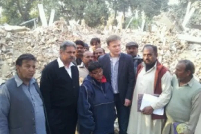 Men inspecting damage of family homes in Pakistan Credit ACN CNA World Catholic News 1 12 12