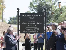 Michael Warsaw unveils the sign for Mother Angelica Way, Sept. 16, 2016. 