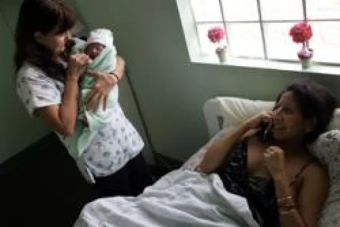 Midwife and baby US Population Nears 300 Million Mark Credit Joe Raedle Getty Images News Getty Images CNA World Catholic News 1 18 12