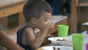 Migrant child has lunch at the Casa de Paso "Divina Providencia" in Cucuta.