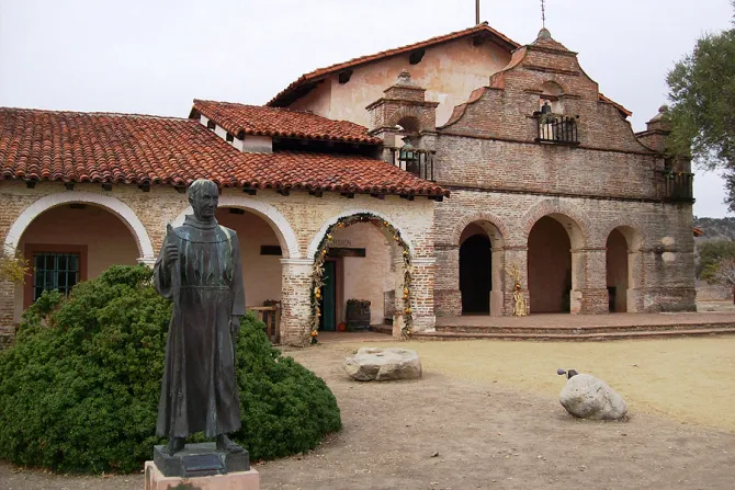 Mission San Antonio de Padua chapel entrance and statue of Bl Junipero Serra in Monterey County CA Credit mlhradio via Flickr CC BY NC 20 CNA 1 22 15